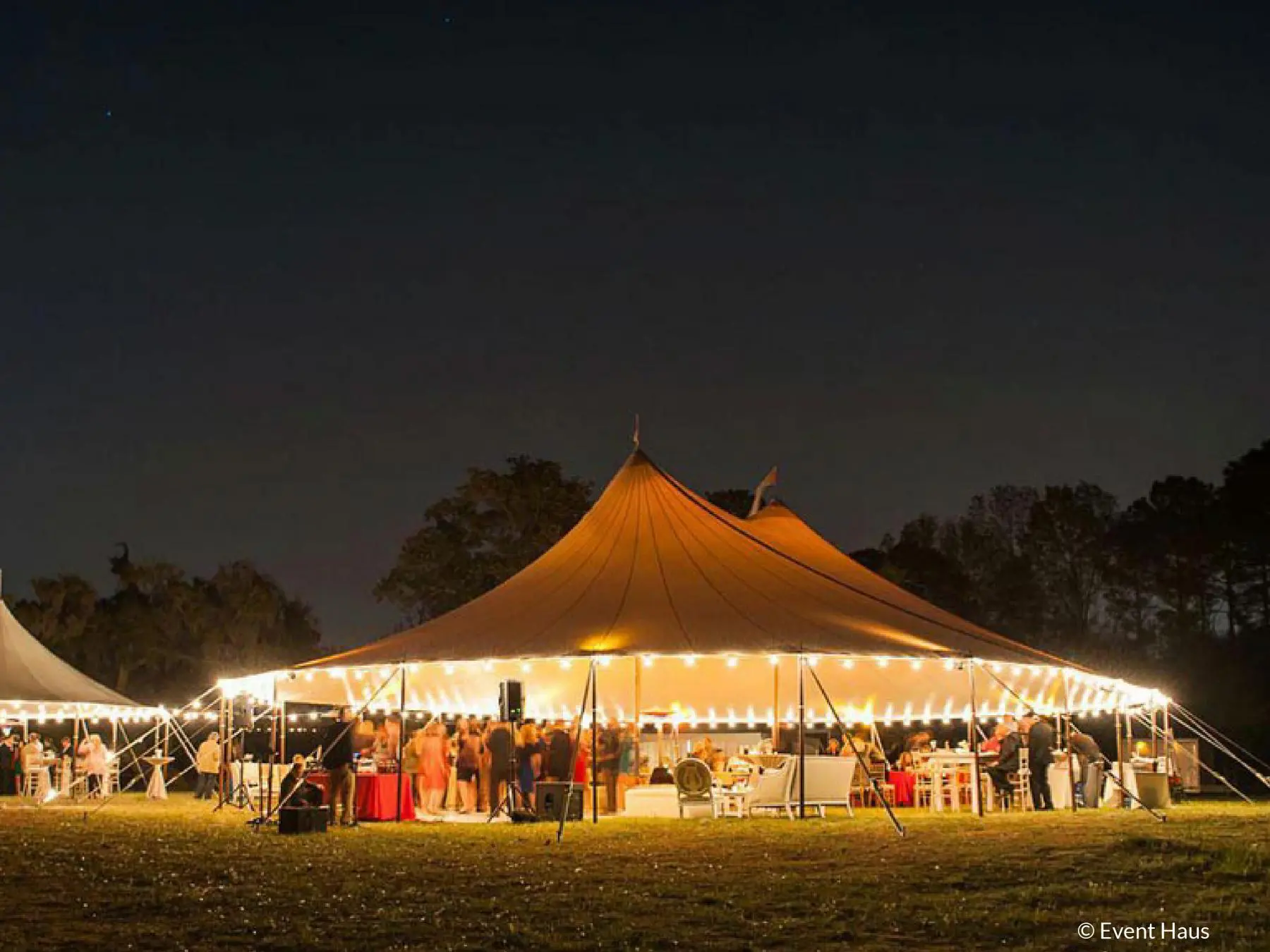 Stillwater tent at night setup with lights